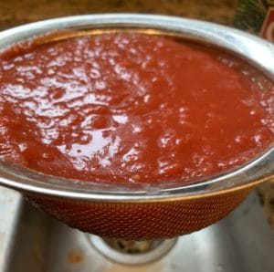 mesh colander strain crushed tomatoes - bar pizza