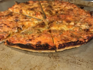 burnt edges on a homemade plain south shore cheese bar pizza