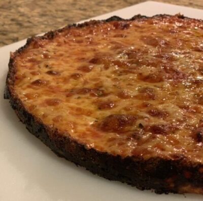 https://barpizzabarpizza.com/wp-content/uploads/2020/04/South-shore-bar-pizza-laced-edges-mozzarella-cheddar-plain-crust-closeup-3-scaled-e1610688776908.jpg